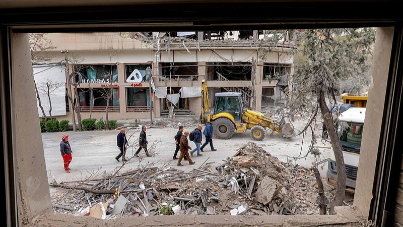 People inspect destruction at a business building that housed the offices of the Doha-headquartered news network Al Araby TV following a missile strike in Tehran, Iran, March 29, 2026. /VCG