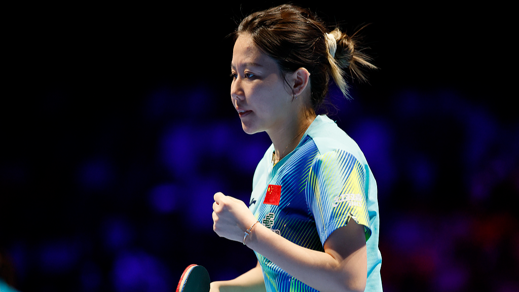 Chen Xingtong of China reacts after earning a point against Andreea Dragoman of Romania in a Group 3 women's singles match at the International Table Tennis Federation Men's and Women's World Cup in China's Macao SAR (Special Administrative Region), March 30, 2026. /VCG