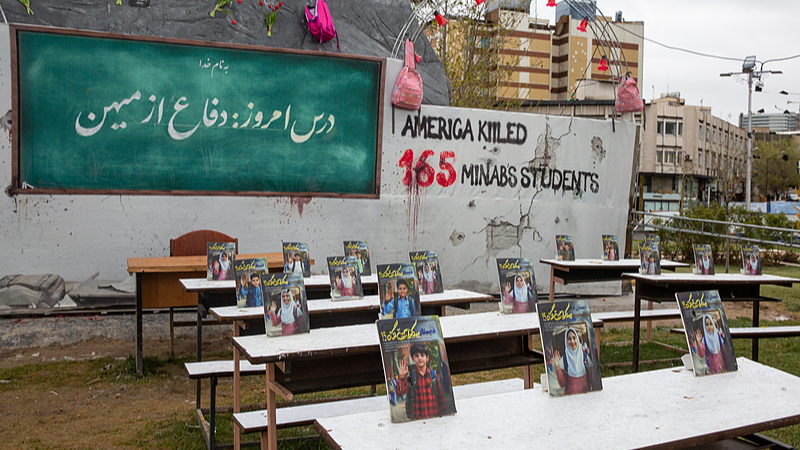 A classroom with photos of the victims of Minab school that was targeted by the US is added to Vanak Square in Tehran, Iran, March 28, 2026. /VCG