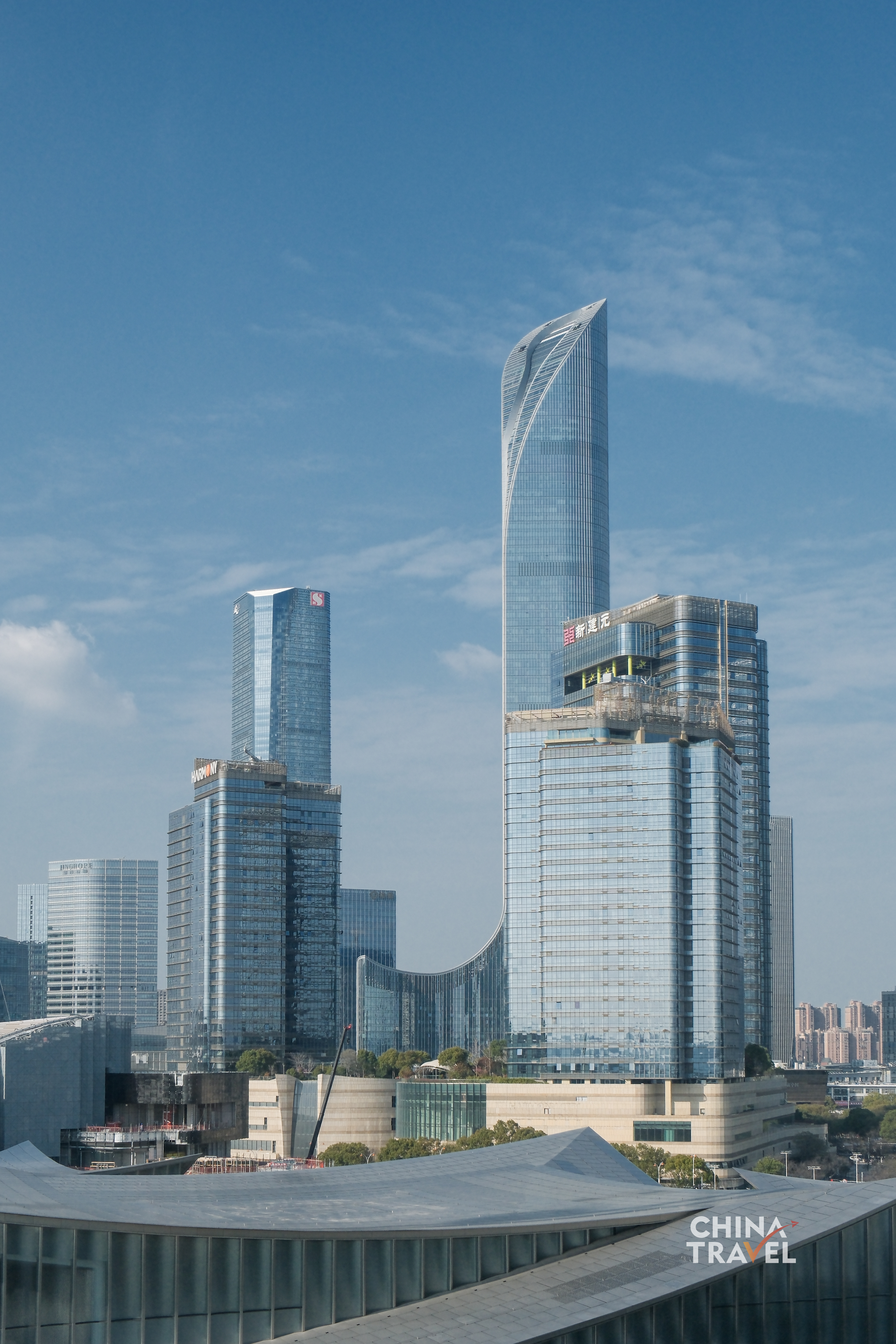 Glass and steel frame the sky, shaping a modern skyline where structure meets light. /CGTN