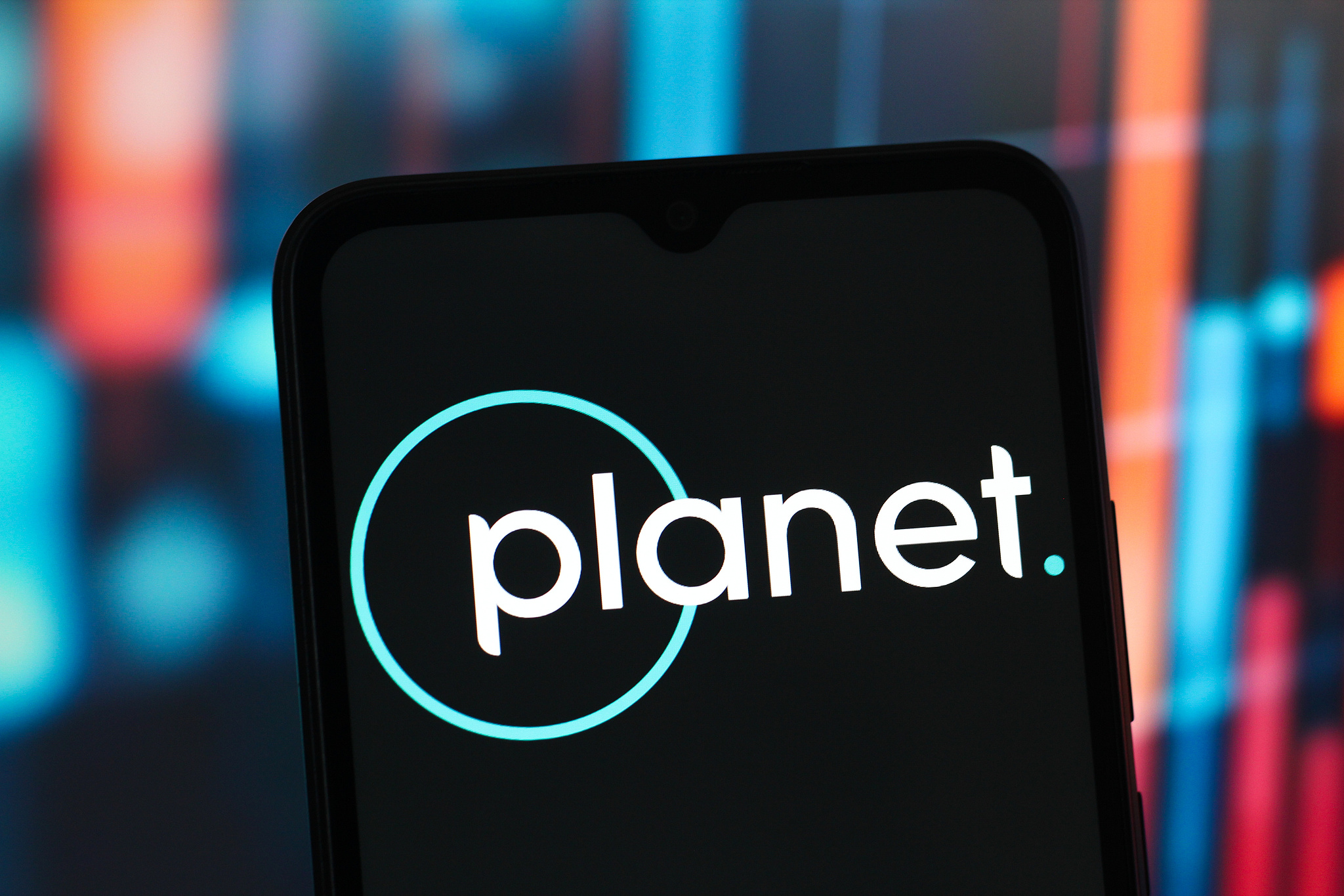 The Planet Labs logo is seen displayed on a smartphone screen. /VCG