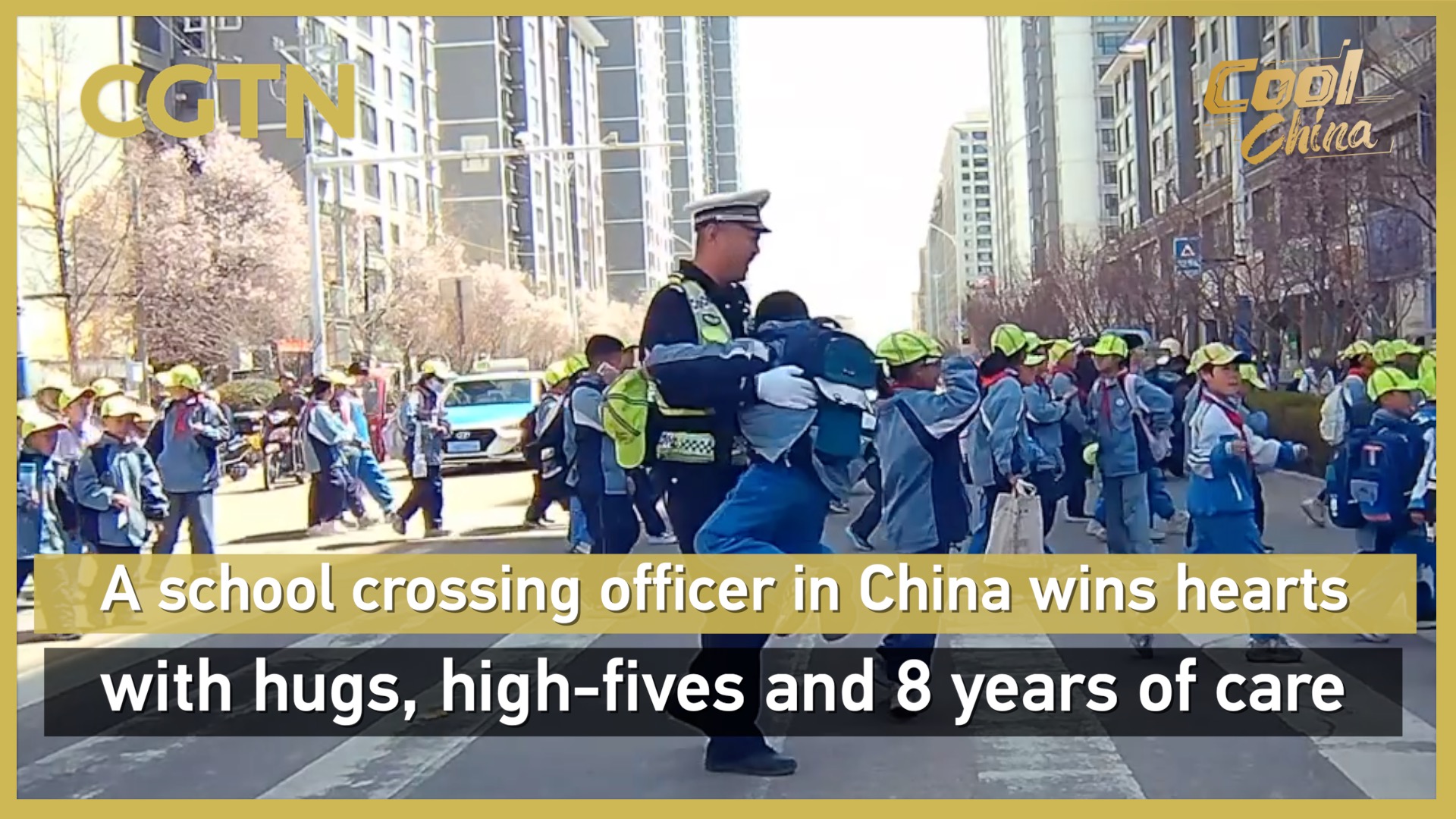 A school crossing officer in China wins hearts with hugs, high-fives