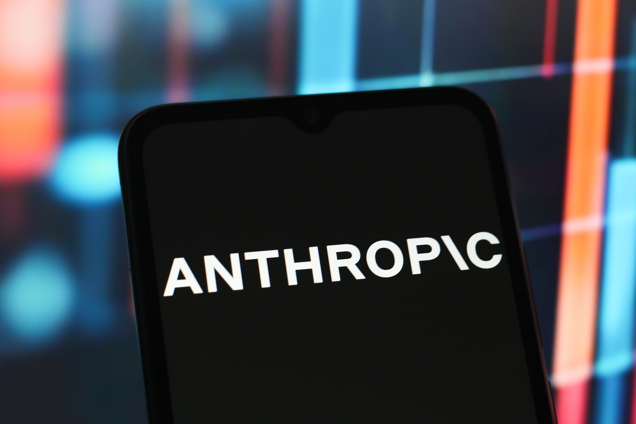 The Anthropic logo is seen displayed on a smartphone screen. /VCG