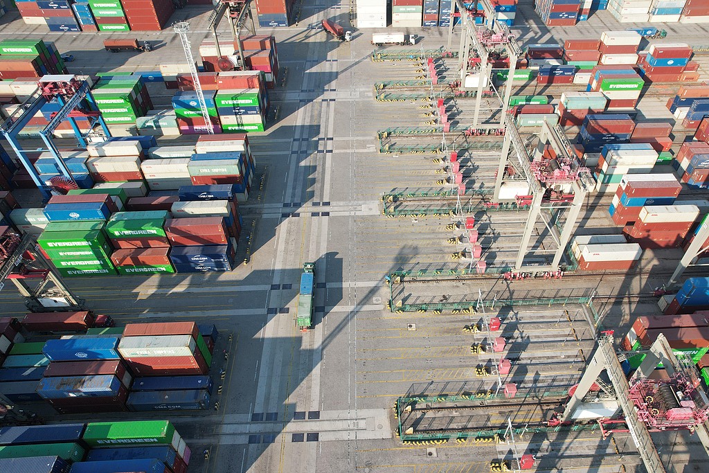 Transport vehicles shuttle at Xiamen Ocean Gate Container Terminal, Xiamen, Fujian Province, China, January 4, 2026. /VCG