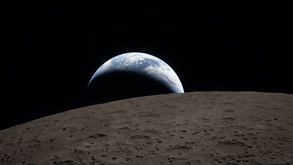 Earthset captured through the Orion spacecraft window during the Artemis II crew's flyby of the moon, April 6, 2026. /VCG