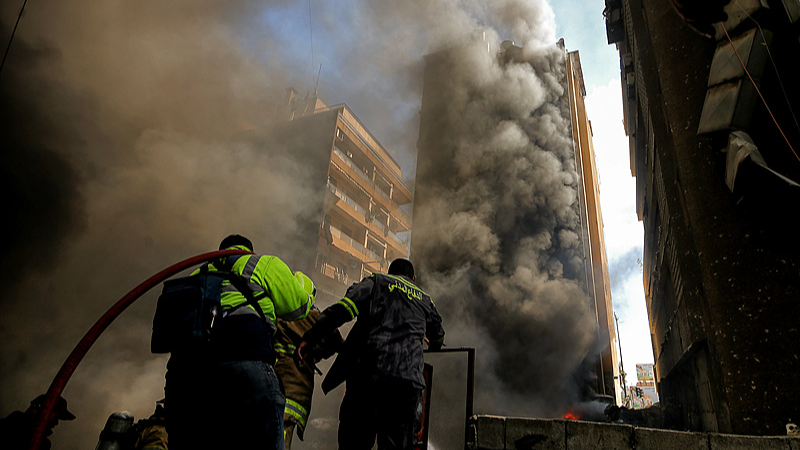 Firefighters hose down a fire at a site hit by an Israeli air strike in Beirut, Lebanon, April 8, 2026. /VCG