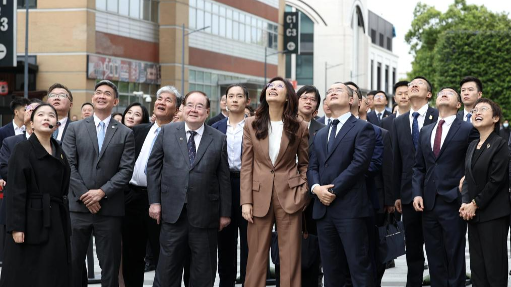 Cheng Li-wun, chairwoman of the Chinese Kuomintang (KMT) party, waits for a delivery drone from Meituan, an on-demand delivery platform, in Shanghai, east China, April 8, 2026. /Xinhua