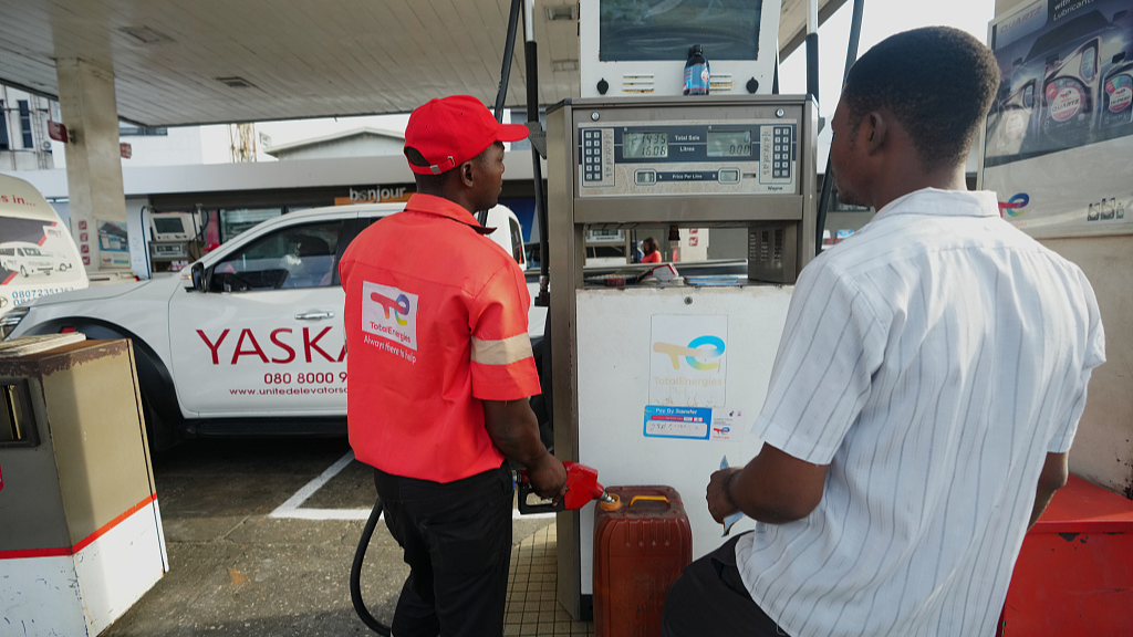 An employee fills a can with fuel at a petrol station in Lagos, Nigeria, March 23, 2026. /VCG