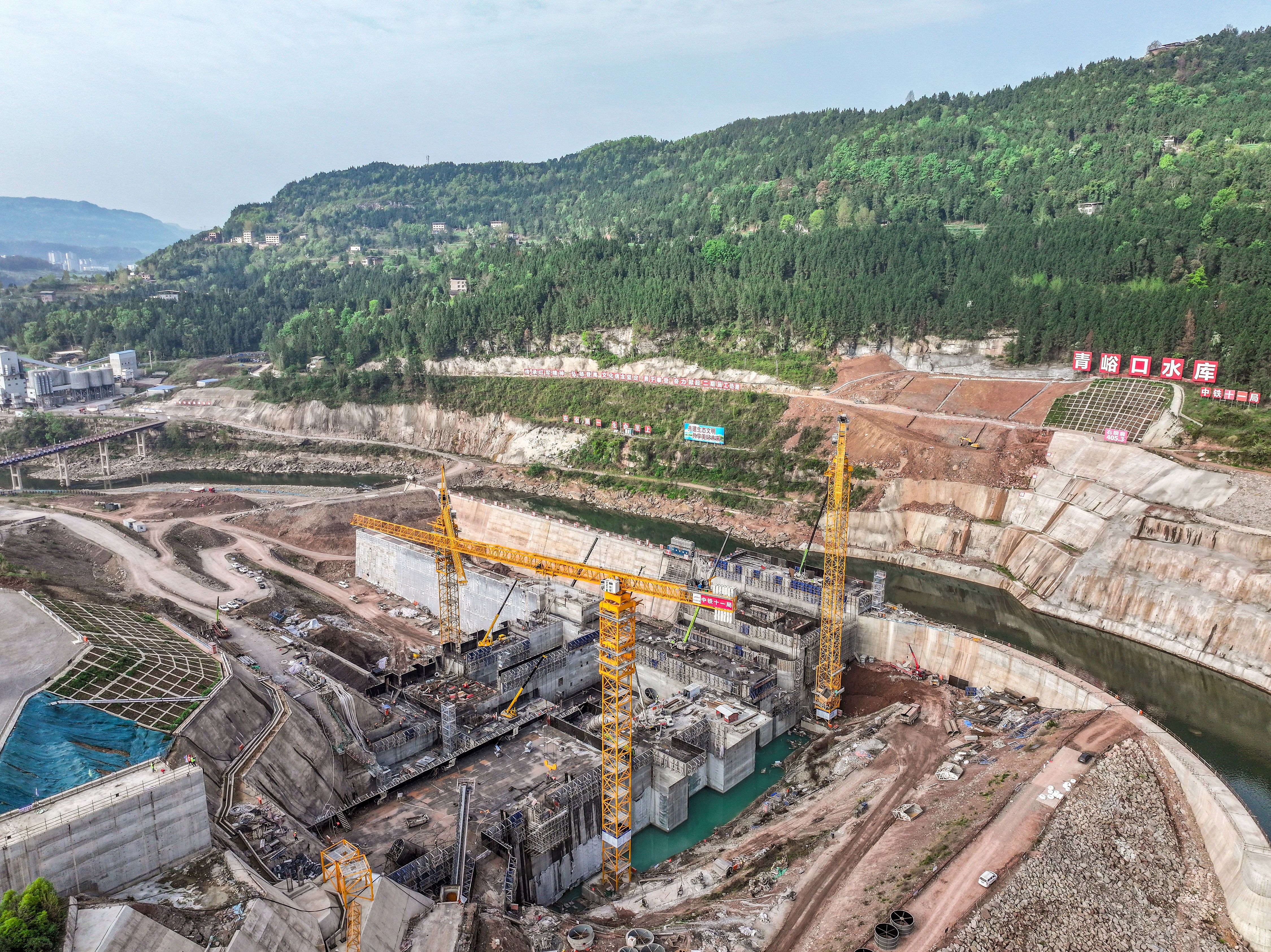 An aerial view of the Qingyukou Reservoir, a key national water infrastructure project currently under construction in Tongjiang County, Bazhong City, Sichuan Province, April 4, 2026. /VCG
