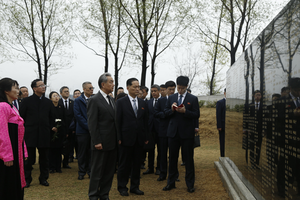 Chinese Foreign Minister Wang Yi pays tribute at the graves of the martyrs of the Chinese People's Volunteers located in Kangdong County, the Democratic People's Republic of Korea, April 10, 2026. /Chinese Foreign Ministry