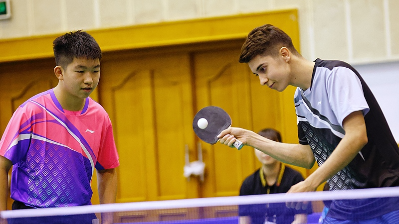 File photo of Chinese and US students playing table tennis during a special summer camp commemorating Ping-Pong Diplomacy at the Beijing Language and Culture University in Beijing, China. /VCG
