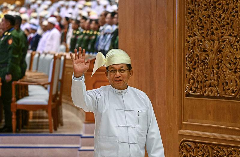Former Myanmar military chief and Myanmar president Min Aung Hlaing waves as he leaves after a session of the Pyidaungsu Hluttaw in Naypyidaw, April 10, 2026. /VCG