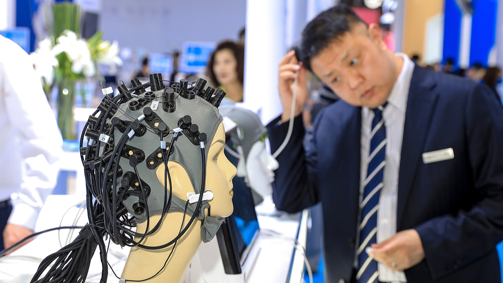 A non-invasive brain-computer interface being demonstrated at a medical device expo in Shanghai, China, April 9, 2026. /VCG