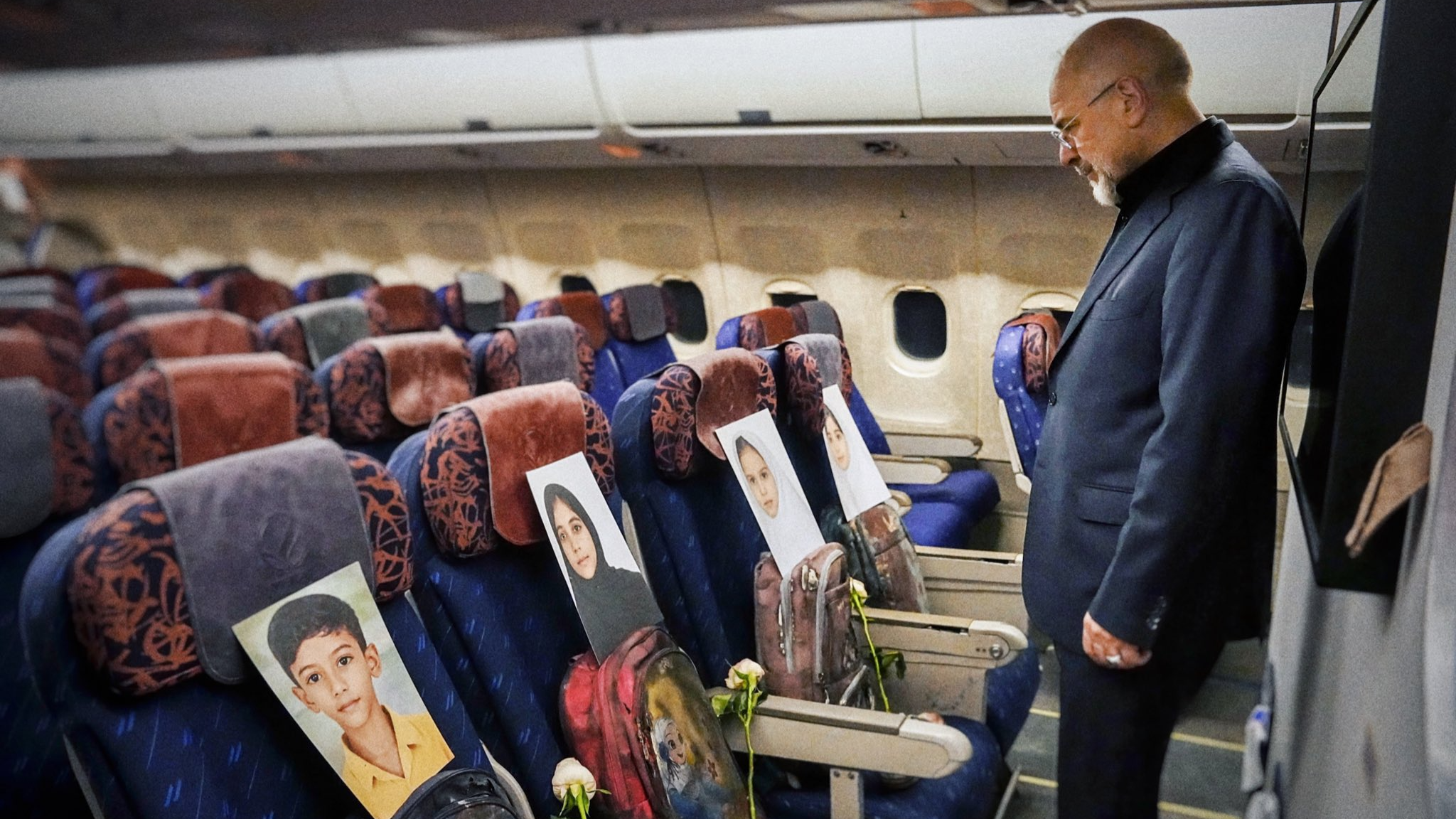 Iran's envoy flies to US talks with photos of slain schoolchildren