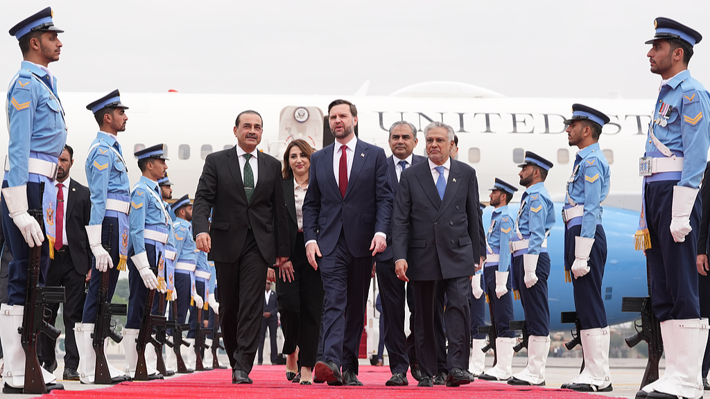 US Vice President J.D. Vance (C, foreground) walks with Pakistan's Chief of Defence Forces and Chief of Army Staff Field Marshall Asim Munir (L, foreground), and Pakistani Deputy Prime Minister and Foreign Minister Mohammad Ishaq Dar (R, foreground) after arriving for talks with Iranian officials, Pakistan, April 11,  2026. /VCG