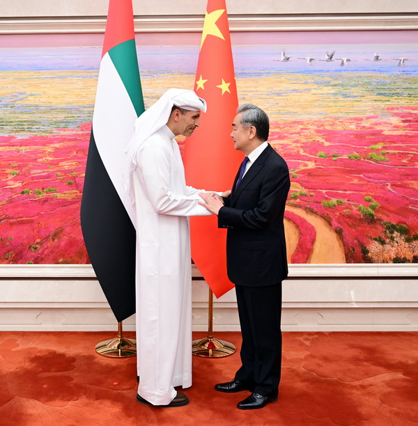 Wang Yi (R), a member of the Political Bureau of the Communist Party of China Central Committee and director of the Office of the Central Commission for Foreign Affairs, meets with Khaldoon Khalifa Al Mubarak, special envoy of the president of the United Arab Emirates (UAE) to China, in Beijing, China, April 13, 2026. /Chinese Foreign Ministry