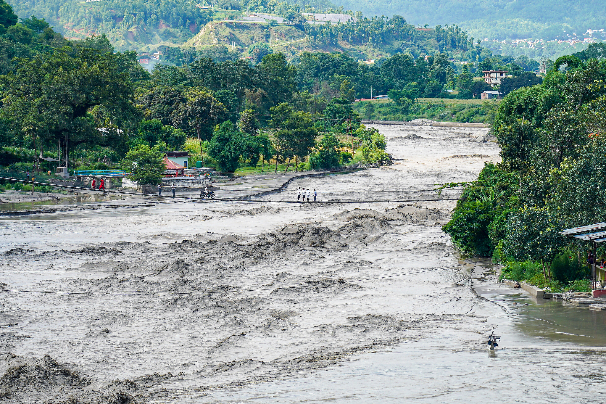The Trishuli River flood affects the riverbanks and houses in Nuwakot, Nepal, July 8, 2025. /VCG