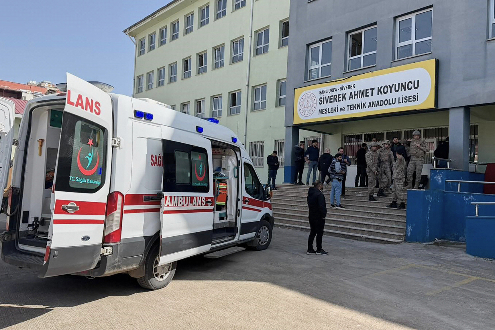 Turkish security forces and emergency staff stand at the courtyard of a high school where a teenager opened fire, in Siverek, Türkiye, April 14, 2026. /VCG