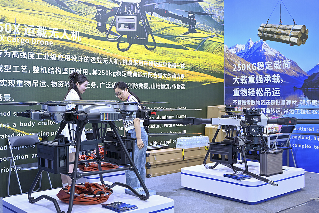 Drone company representatives are setting up an exhibition booth at the 139th China Import and Export Fair (Canton Fair), April 14, 2026. /VCG