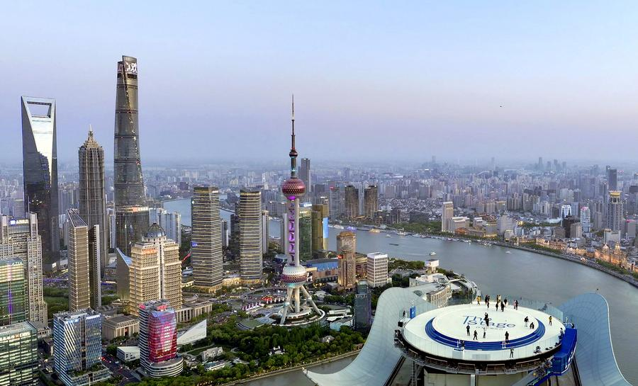 Visitors admire the cityscape from The Stage, a new observation deck atop White Magnolia Plaza in Shanghai, east China, April 14, 2025. /Xinhua