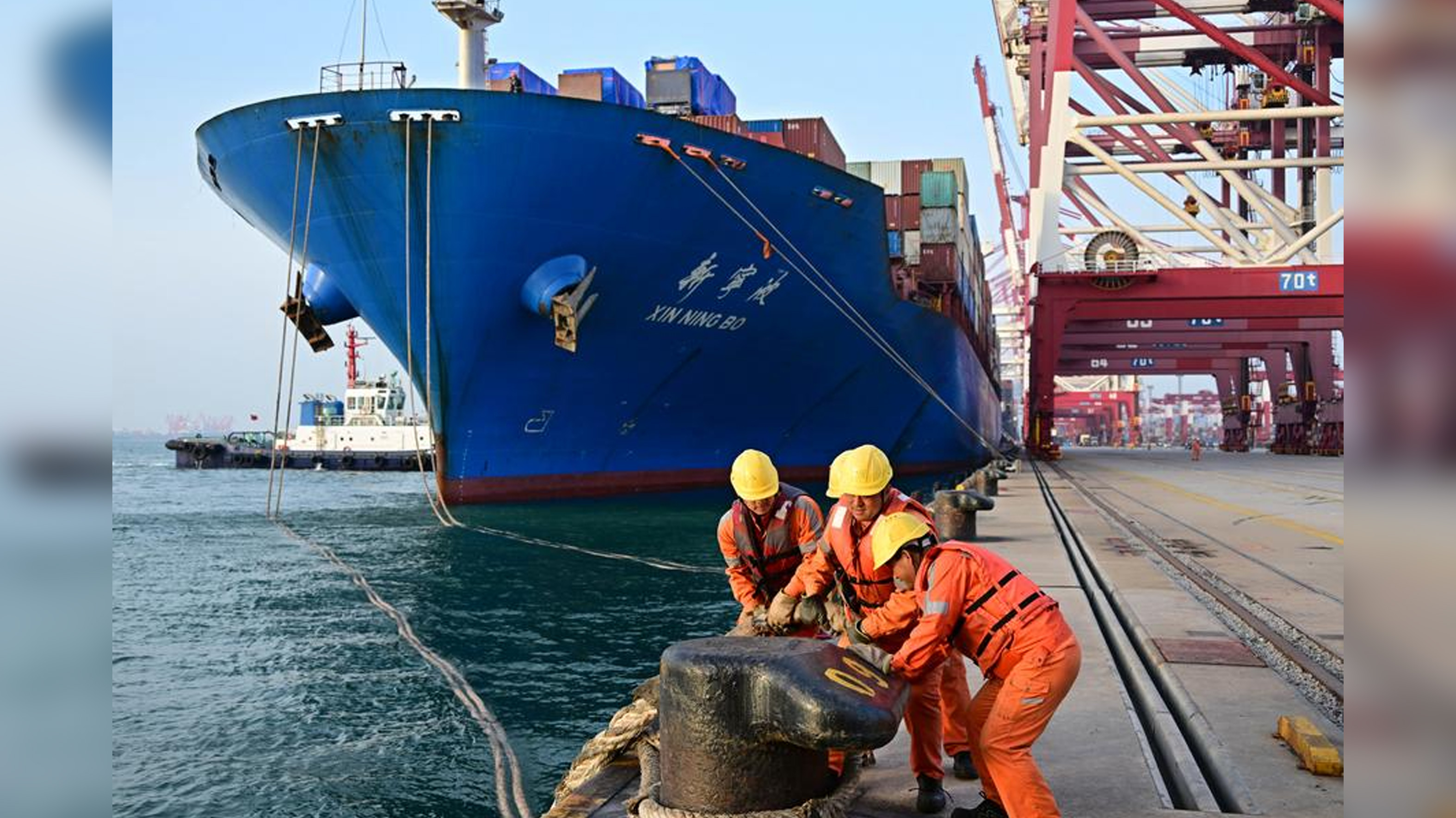 Workers cast off the ropes for a ship bound for ASEAN countries at a container dock of Qingdao Port in Qingdao, east China's Shandong Province, April 30, 2025. /Xinhua
