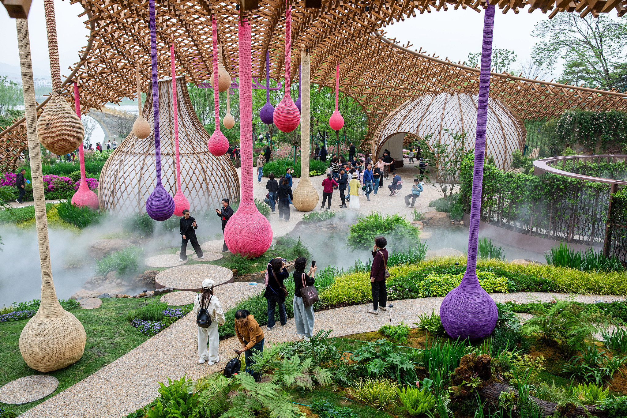 Tourists enjoy the view of the 15th China International Garden Expo, Wenzhou, Zhejiang Province, east China, April 15, 2026. /VCG
