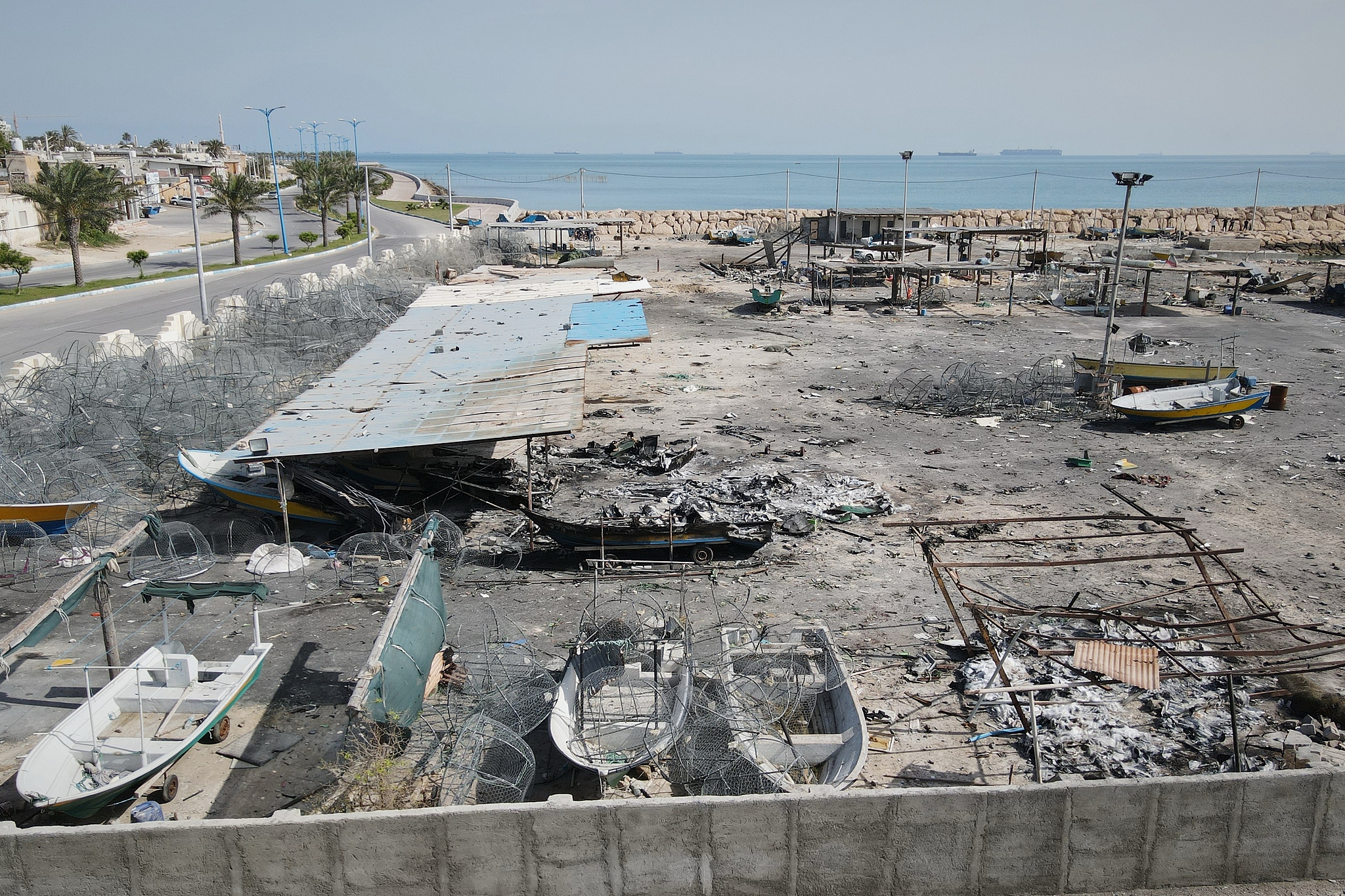 Damage is seen on a fishing pier in the port of Qeshm Island, Iran, April 13, 2026. /VCG