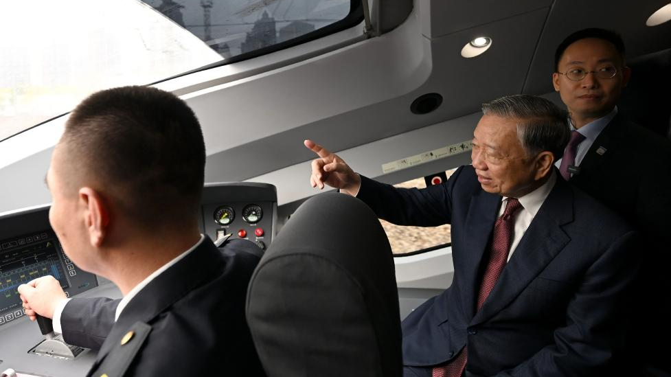 General Secretary of the Communist Party of Vietnam Central Committee and Vietnamese President To Lam, who is on a state visit to China, tours the driver's cabin as he takes a high-speed train on his way from Beijing, capital of China, to south China's Guangxi Zhuang Autonomous Region, April 16, 2026. /Xinhua