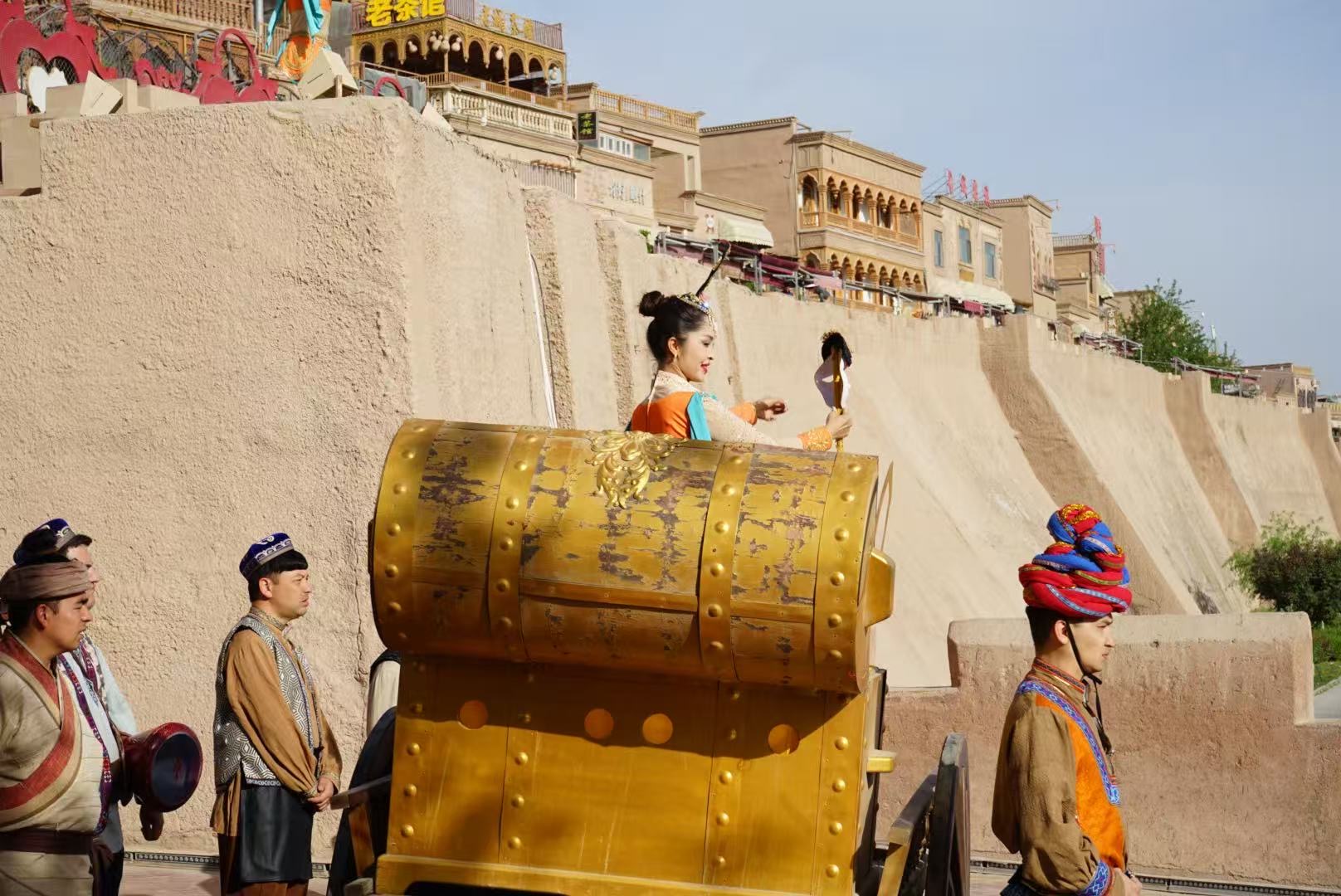 People perform during the gate opening ceremony of the ancient city of Kashi in northwest China's Xinjiang Uygur Autonomous Region on April 17, 2026. /CGTN
