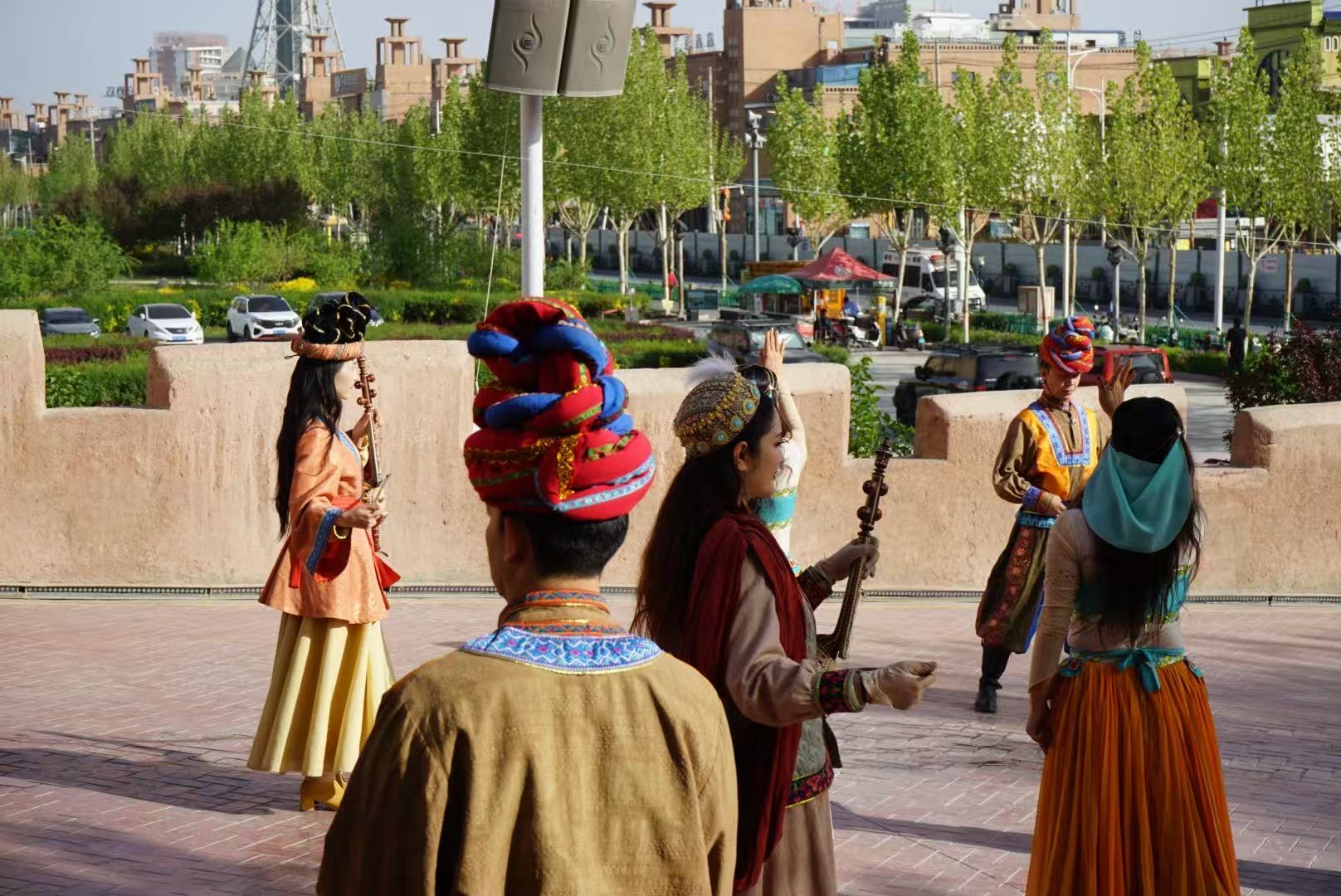 People perform during the gate opening ceremony of the ancient city of Kashi in northwest China's Xinjiang Uygur Autonomous Region on April 17, 2026. /CGTN
