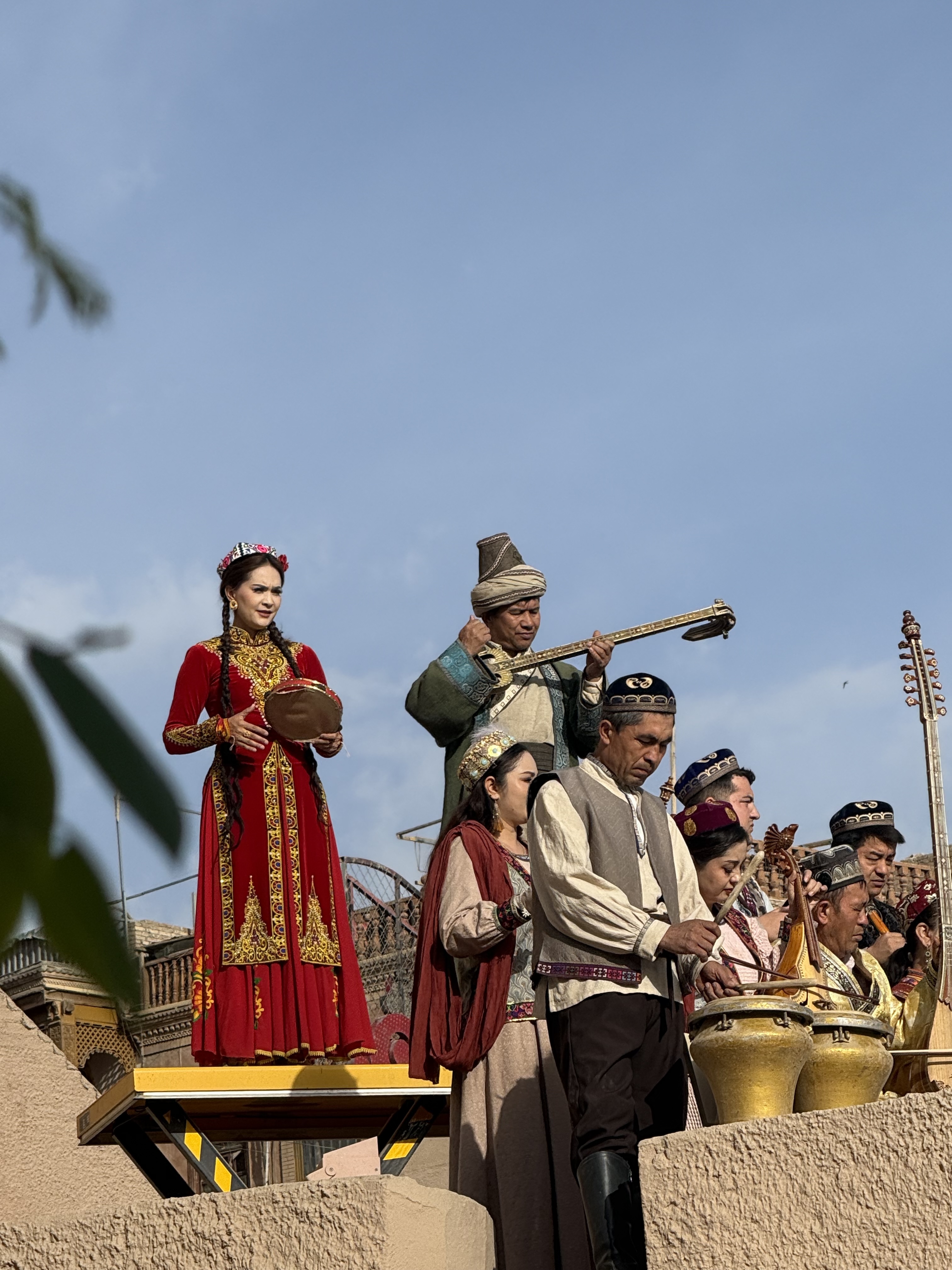 People perform during the gate opening ceremony of the ancient city of Kashi in northwest China's Xinjiang Uygur Autonomous Region on April 17, 2026. /CGTN