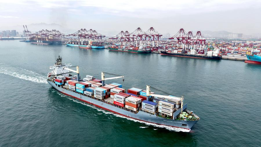 A cargo ship with containers leaving Qingdao Port in east China's Shandong Province, April 14, 2026. /Xinhua