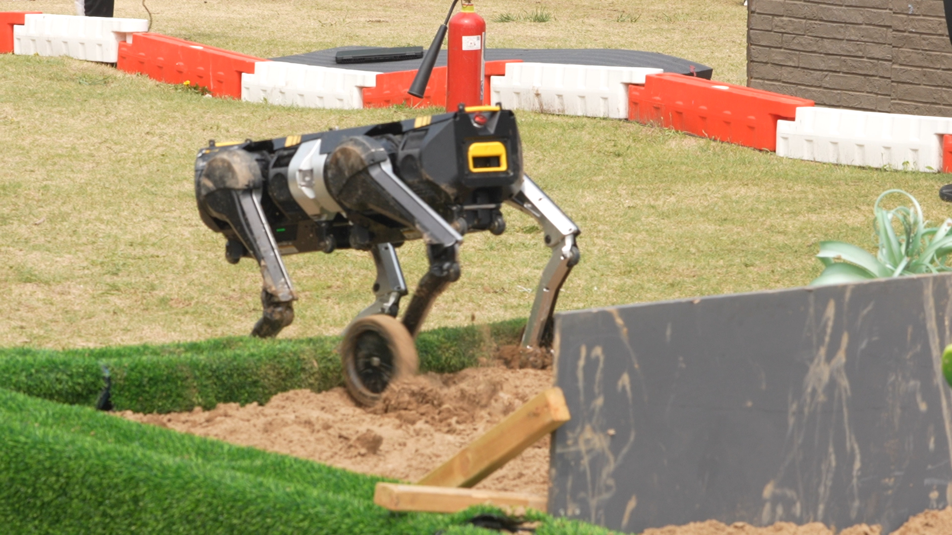 A quadruped robot goes through obstacles at the robot warrior challenge in Beijing, April 18, 2026. /CGTN
