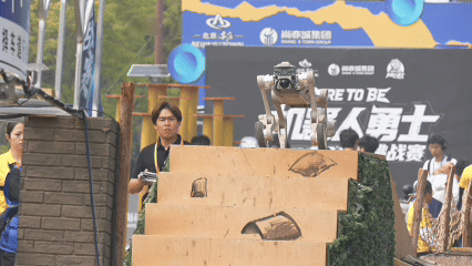 A quadruped robot goes down stairs at the robot warrior challenge in Beijing, April 18, 2026. /CGTN