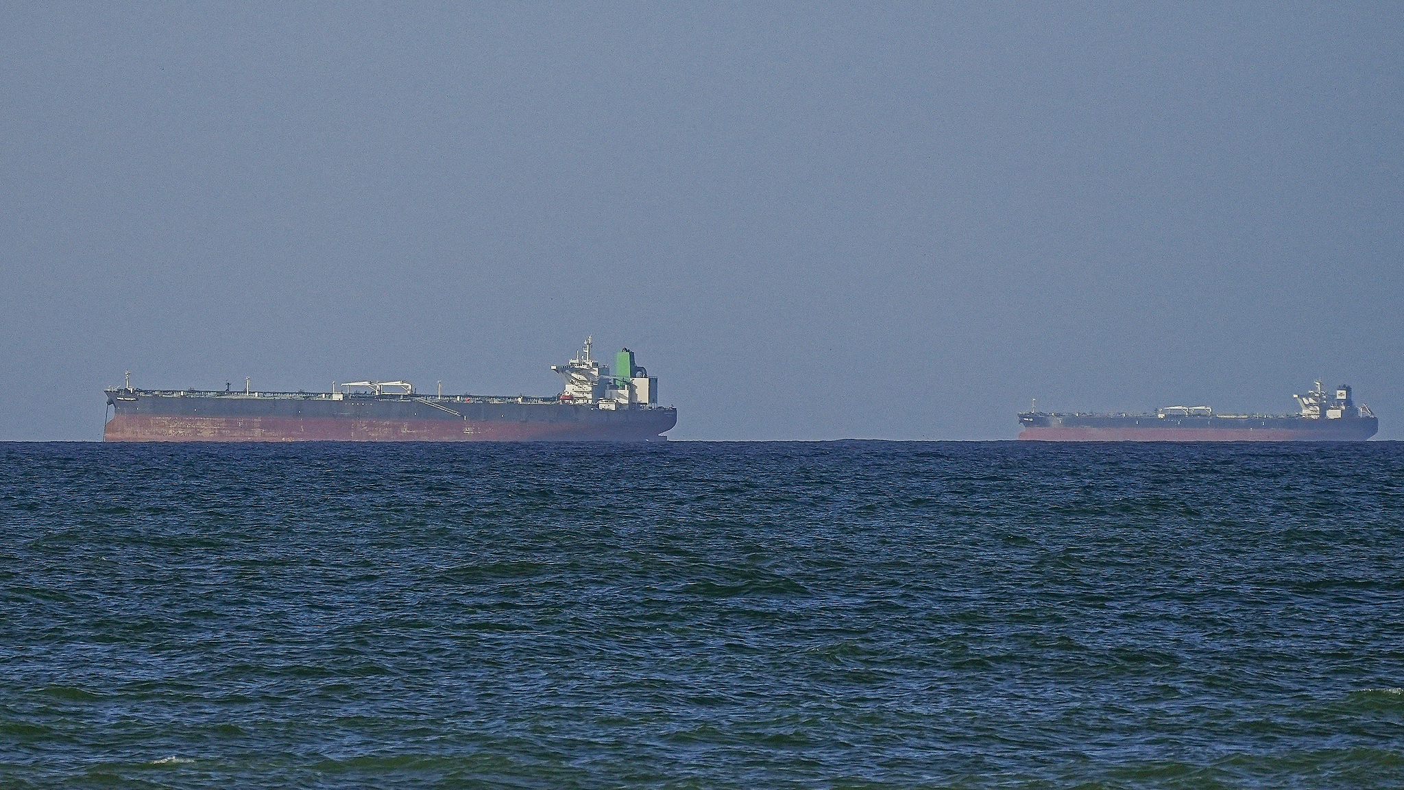 Iran warns Strait of Hormuz may not stay open as tensions escalate