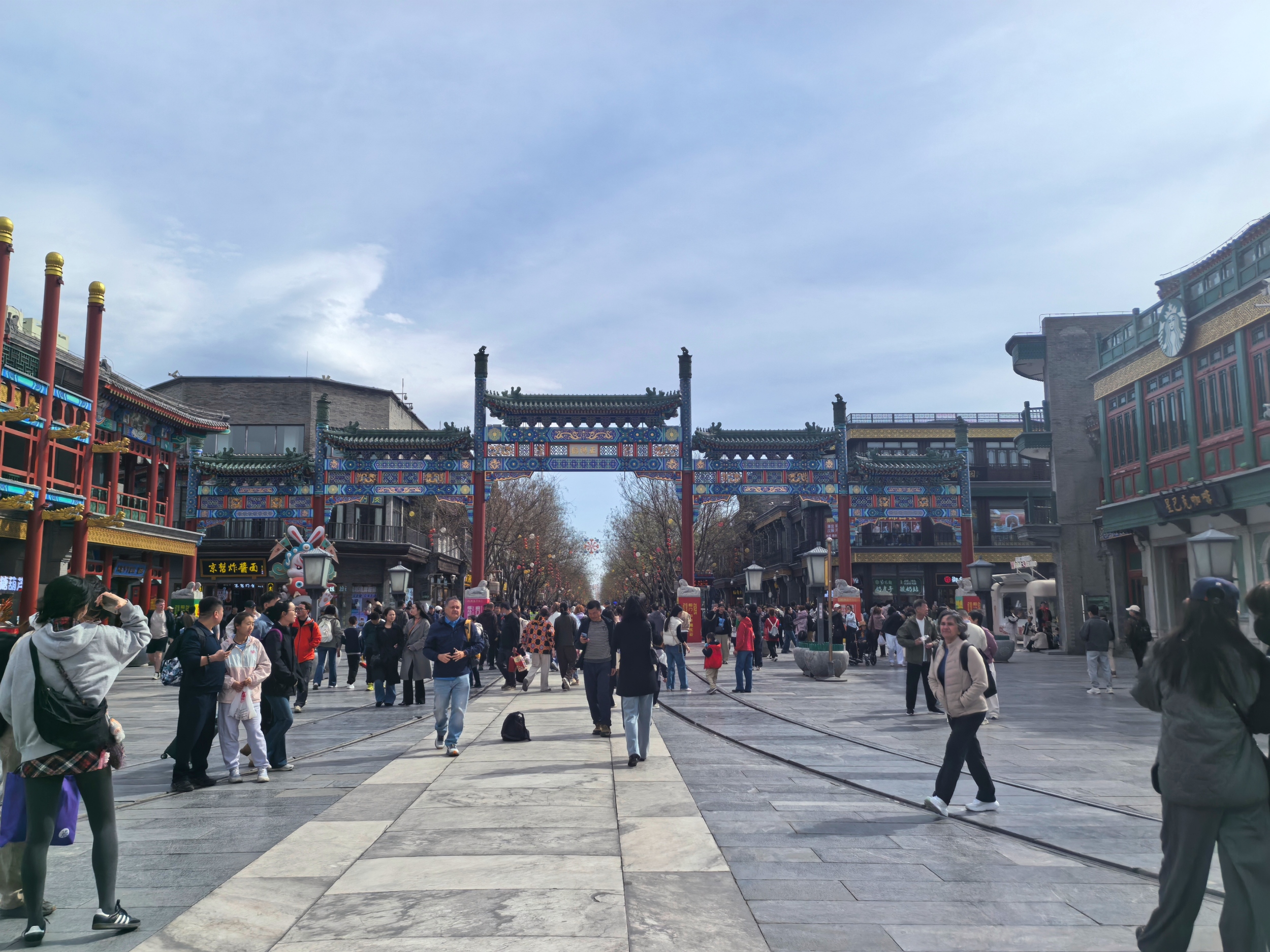 Tourists from China and abroad visit Qianmen Street in Beijing on April 6, 2026. /CGTN
