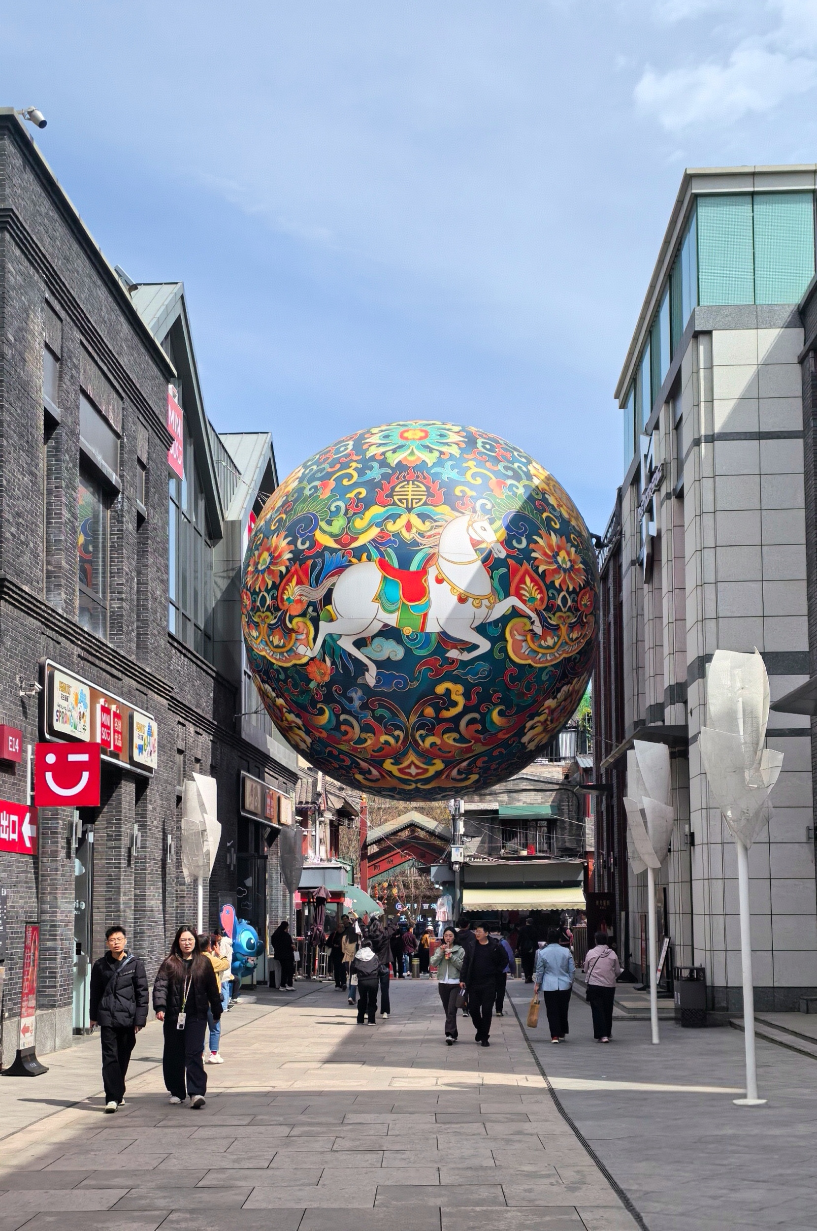 People visit Qianmen Street in Beijing on April 6, 2026. /CGTN