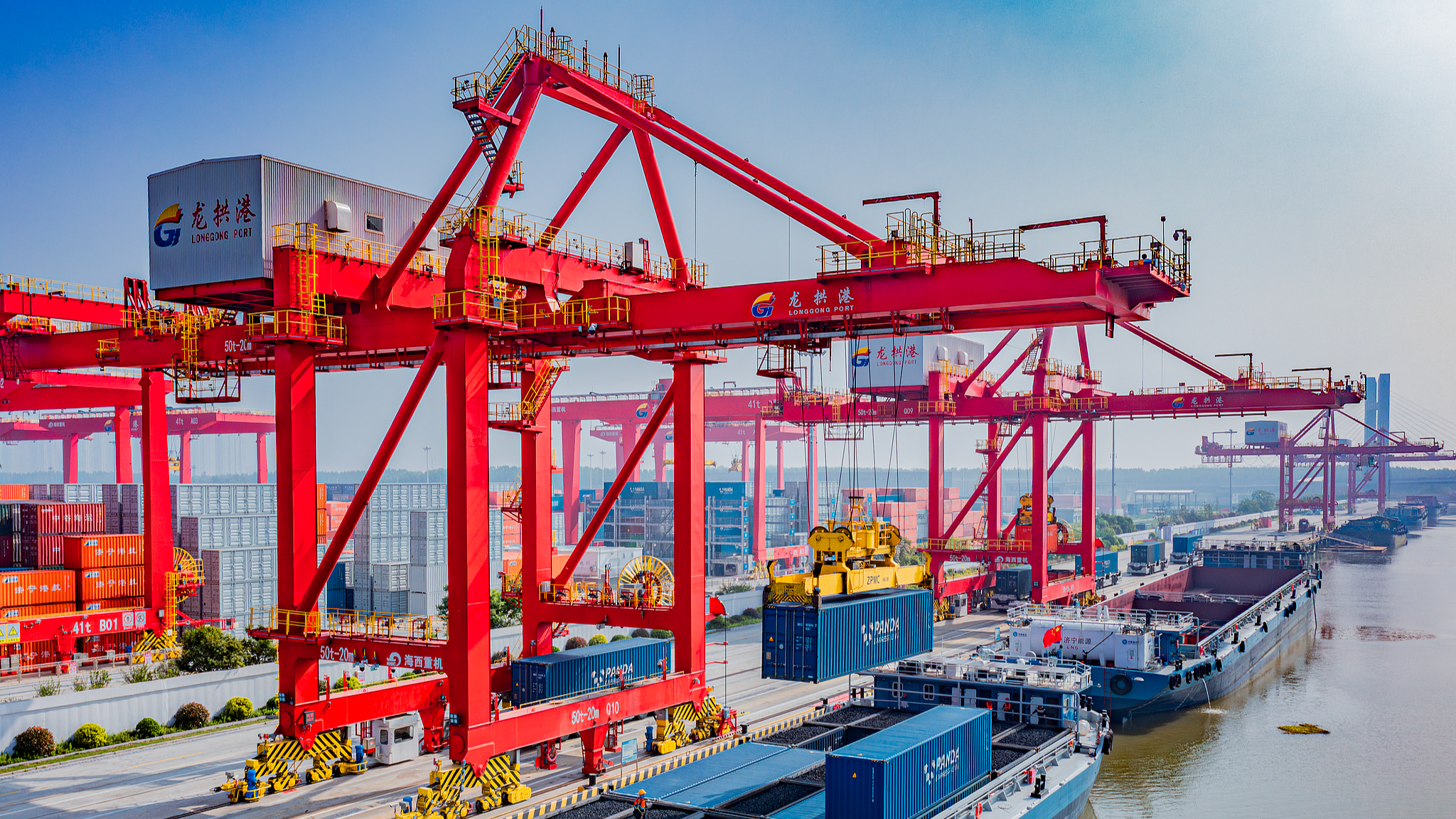 Container cranes load and unload cargo at Longgong Port in Jining, east China's Shandong Province, April 18, 2026. /VCG