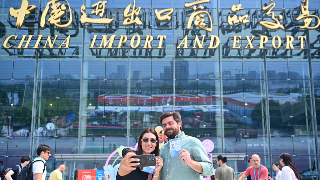 Foreign buyers posing outside the Canton Fair exhibition hall, Guangzhou, China, April 19, 2026. /VCG