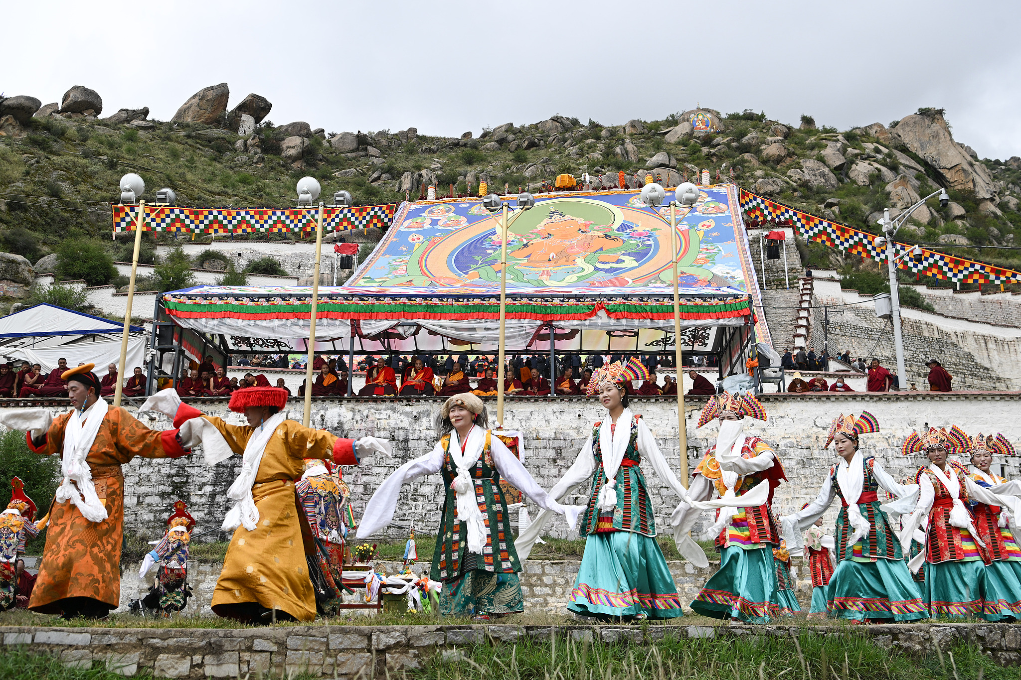 A giant thangka painting of the Maitreya Buddha – the Buddha of the future – is displayed outside the Drepung Monastery in Lhasa, Xizang Autonomous Region, to celebrate the traditional Shoton Festival, August 23, 2025. /CFP