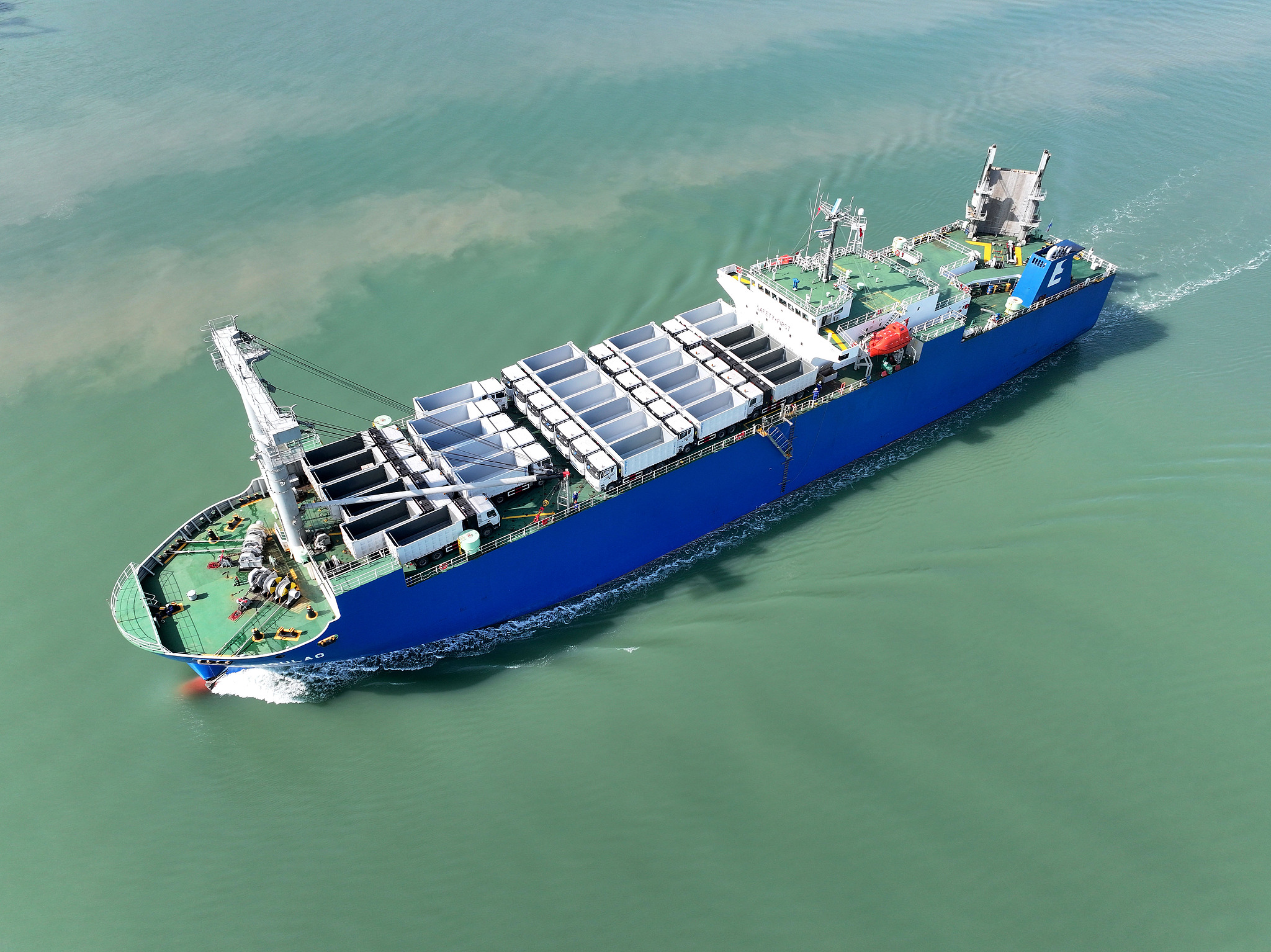 A vessel loaded with engineering vehicles leaves its berth at the Dongfang Port Branch of Lianyungang Port, bound for Africa, on April 15, 2026, in Lianyungang, Jiangsu Province. /VCG