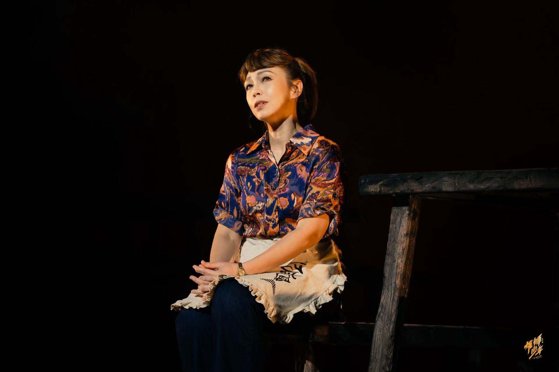 A stage photo of Kit Chan in the musical 