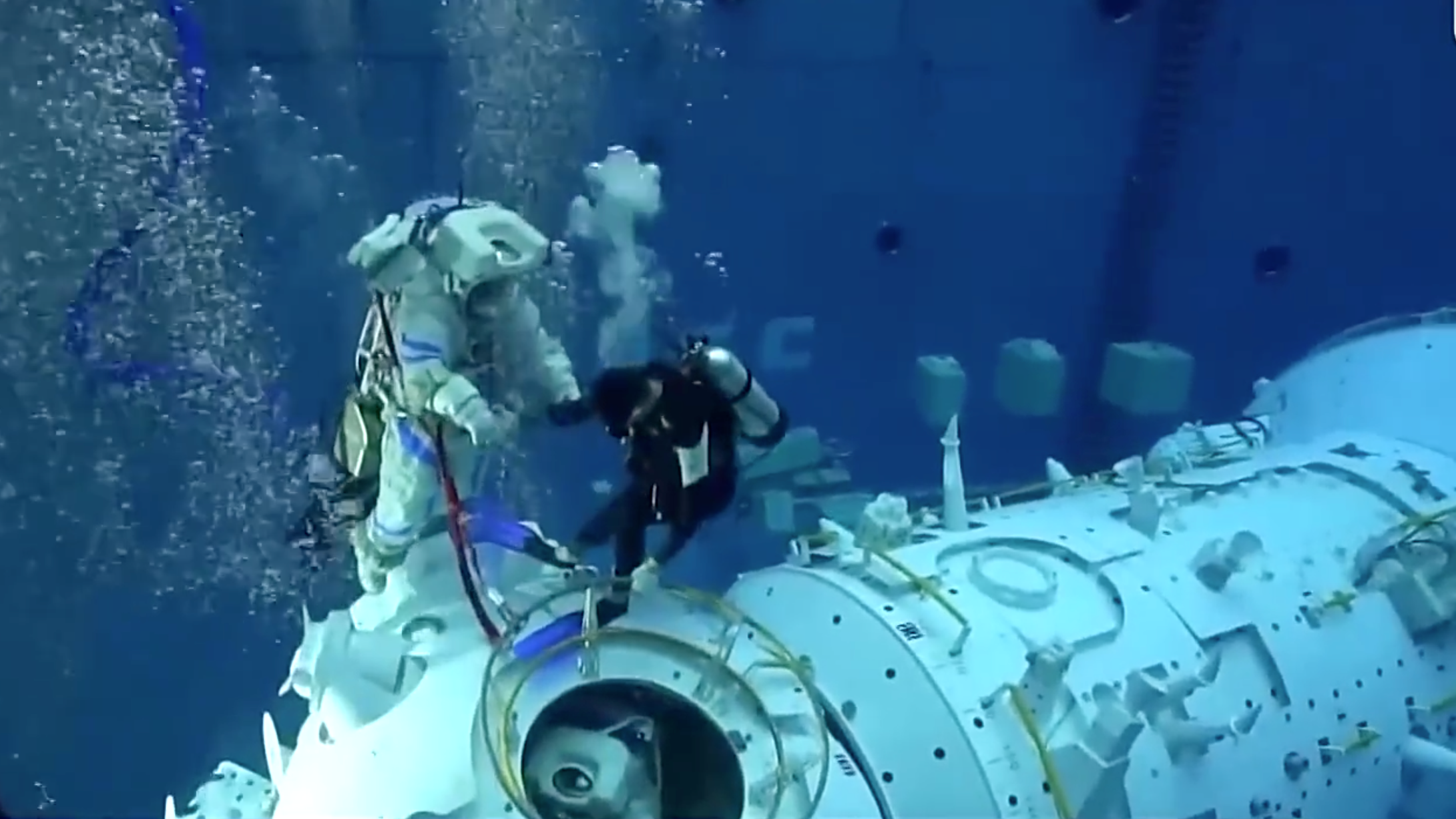 Astronauts undergo underwater training. /CMG