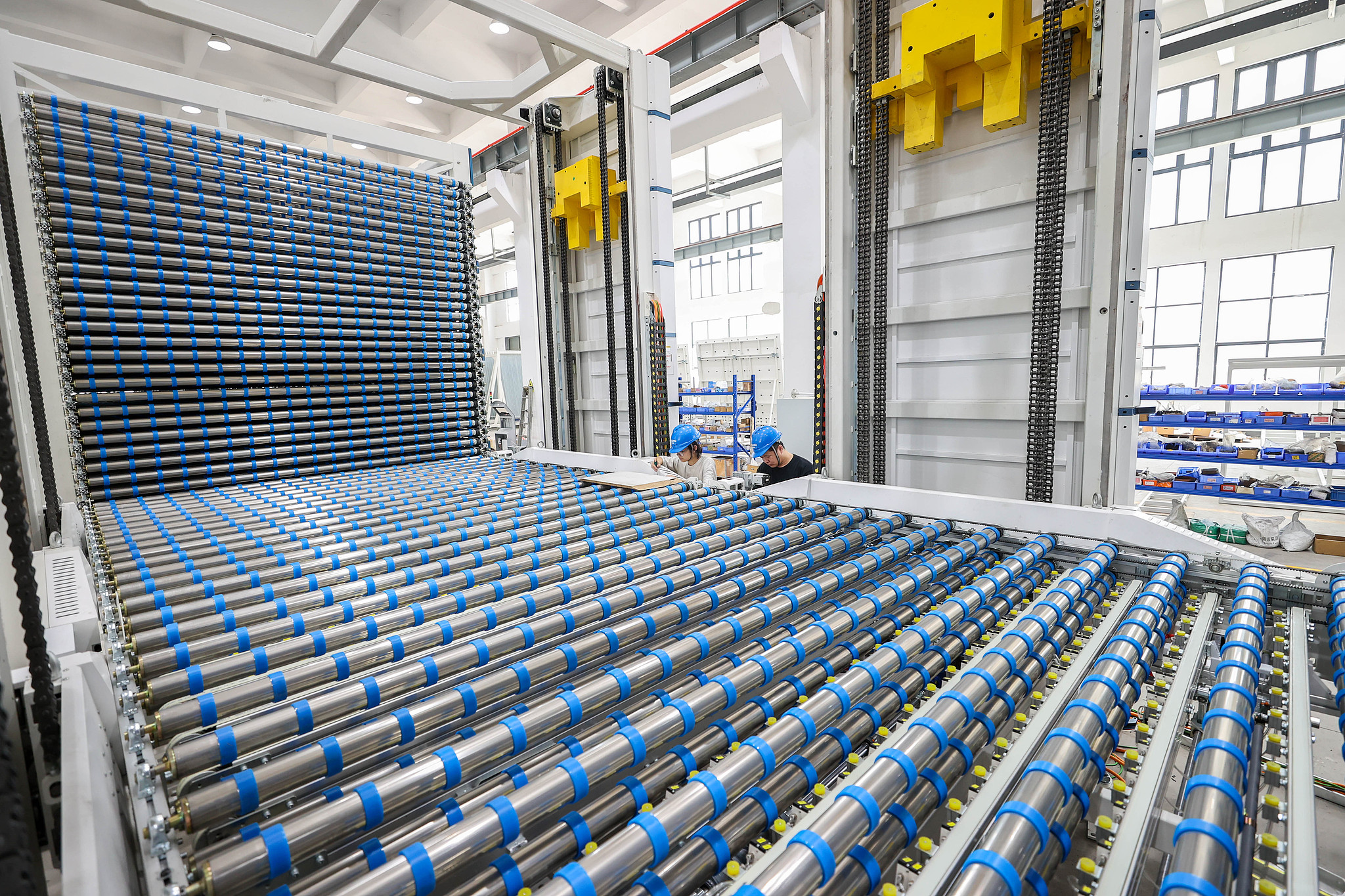 Technicians test a patented lifting system on an intelligent production line in Leidian Town, Zhejiang Province, east China, July 17, 2025. /VCG
