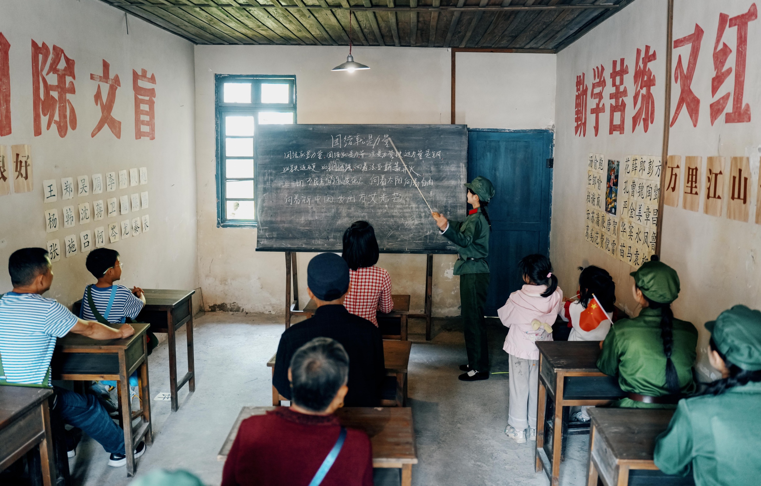 Tourists participate in immersive experiences at Zhusha Ancient Town in Wanshan, southwest China's Guizhou Province on April 18, 2026. /Tongren Media Convergence Center