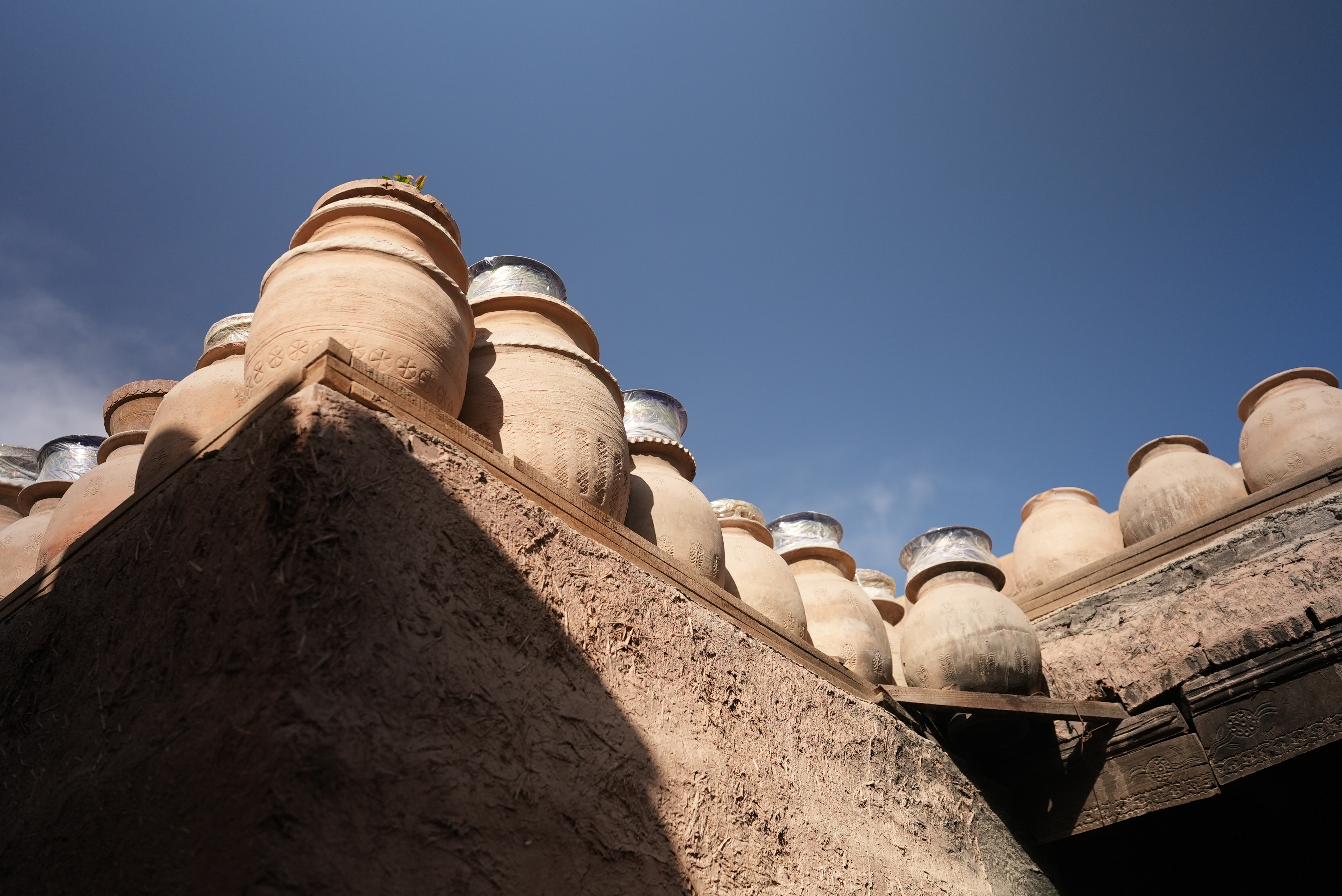 Clay pots are seen in Tursun Rustam's workshop in the ancient city of Kashi, Xinjiang. /CGTN