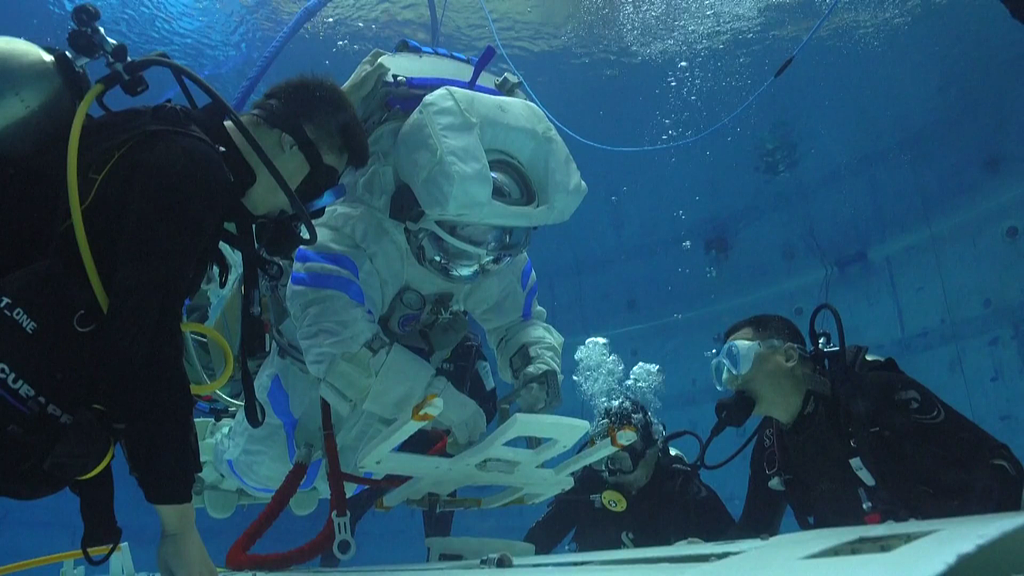 Chinese astronauts undergo underwater training. /VCG