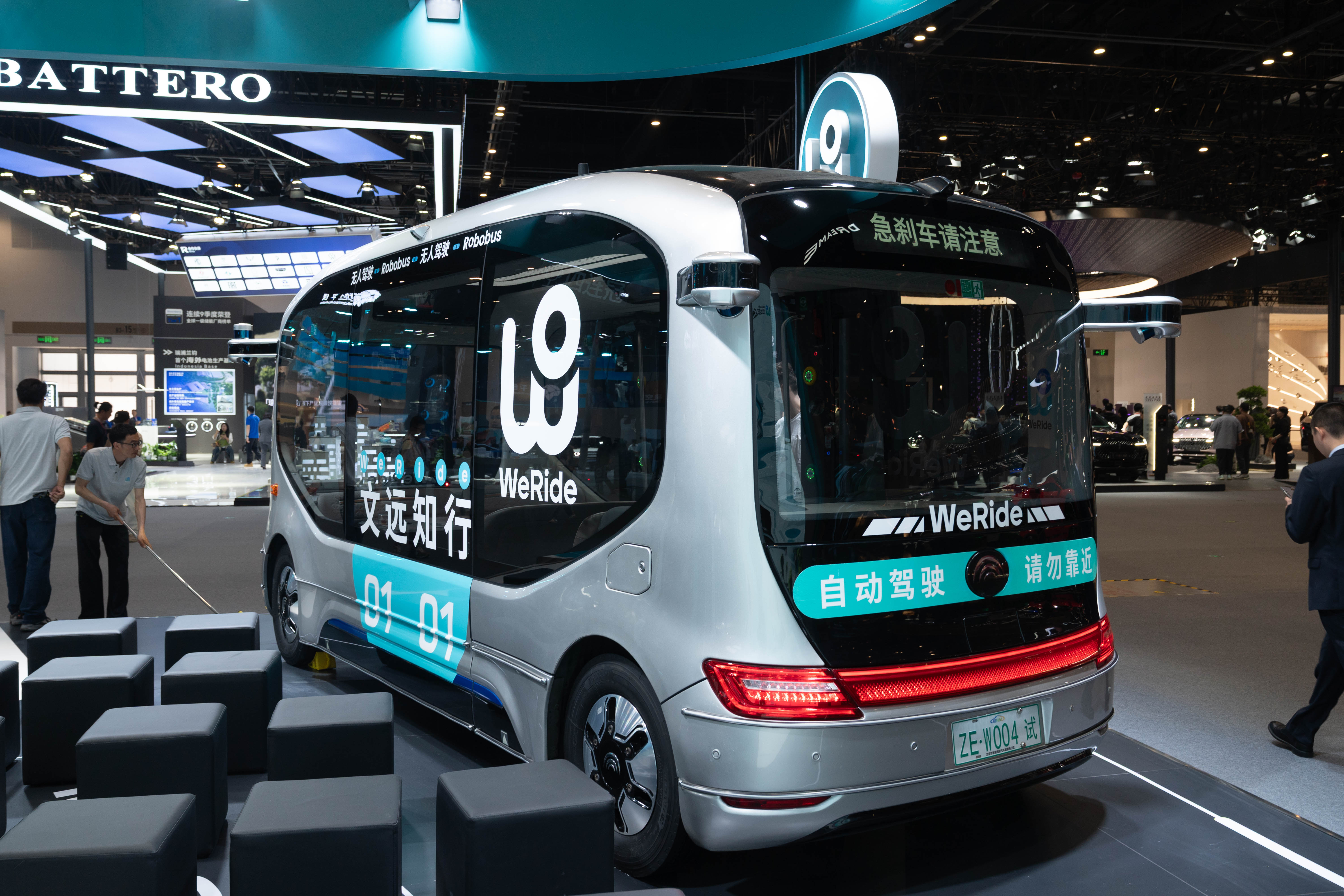 An autonomous electric minibus is on display at the 2026 Beijing Automotive Exhibition on April 24, 2026. /CGTN Photographer Qu Bo