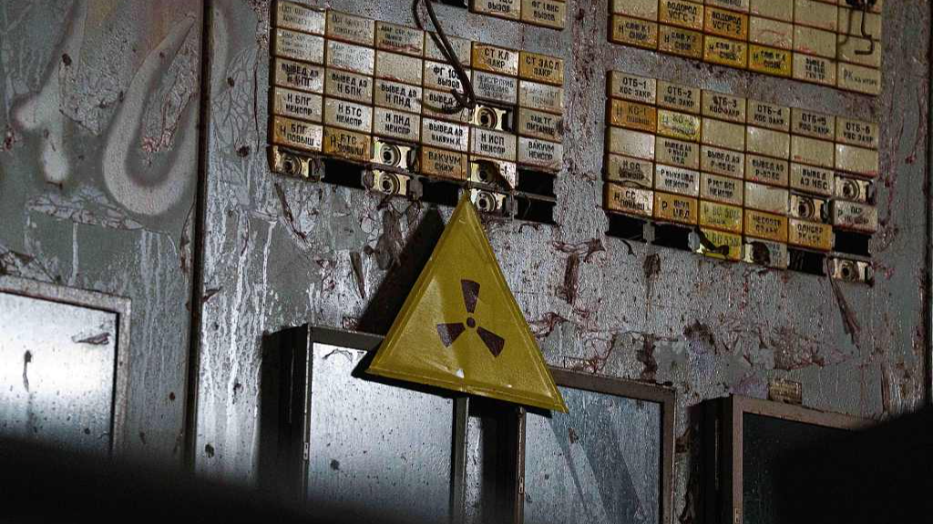 A radiation warning sign is seen in the control room for Reactor No. 4 that exploded and burned in 1986 at the Chernobyl nuclear power plant in Ukraine, April 6, 2026. /VCG