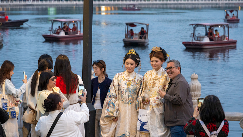 International visitors explore the Shichahai scenic area in Beijing, China, April 22, 2026. /VCG